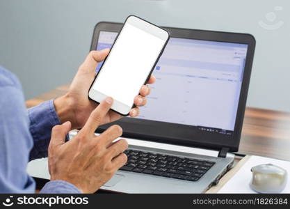 Hand using smartphone mobile internet technology work in office