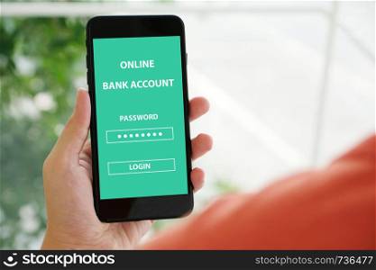 Hand using smartphone with online bank account password login on screen over blur background, online banking cyber security concept