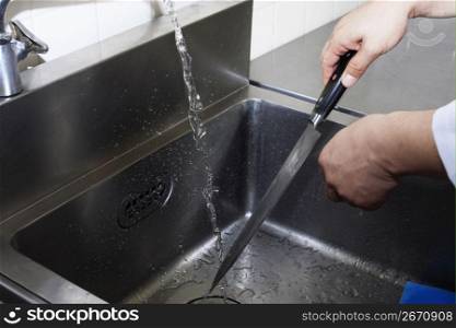 hand washing a knife