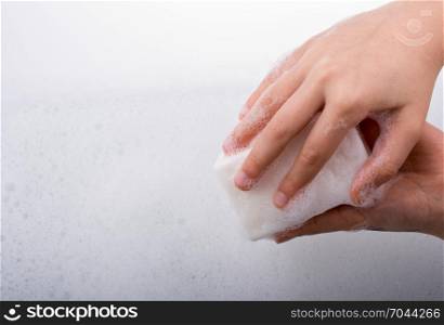 Hand washing and soap foam on a foamy background