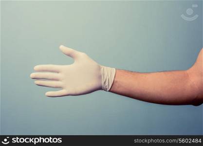 Hand wearing a latex glove
