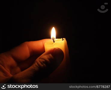 hand with candle