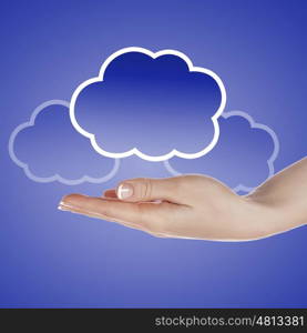 Hand with cloud computing symbol against colour background