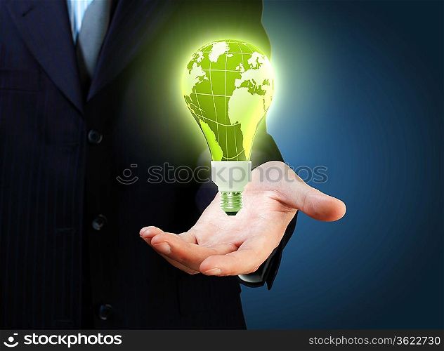 Hand with lamp and hands of a business person