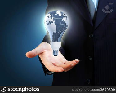 Hand with lamp and hands of a business person