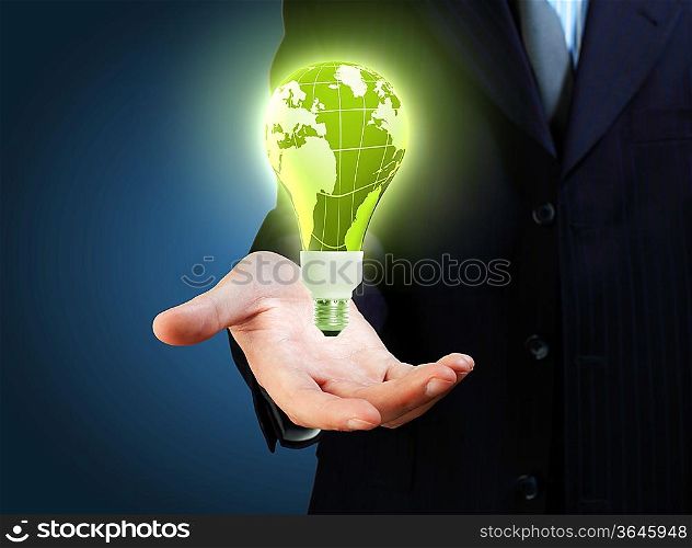 Hand with lamp and hands of a business person