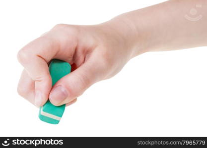 hand with new green rubber eraser close up isolated on white background