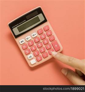 hand with pink calculator colored surface. Resolution and high quality beautiful photo. hand with pink calculator colored surface. High quality beautiful photo concept