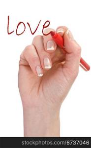 "hand with red marker writing word "love""