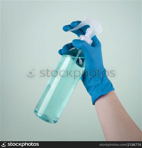 hand with surgical glove using disinfectant