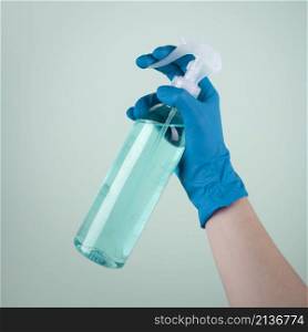 hand with surgical glove using disinfectant