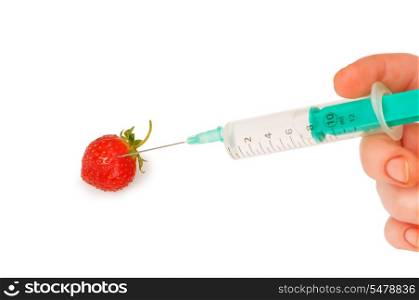 Hand with syringe and red strawberry on white
