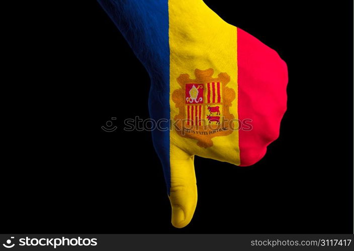 Hand with thumb down gesture in colored andorra national flag as symbol of negative political, cultural, social management of country