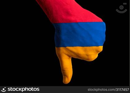 Hand with thumb down gesture in colored armenia national flag as symbol of negative political, cultural, social management of country