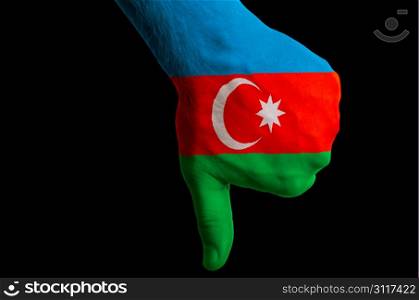 Hand with thumb down gesture in colored azerbaijan national flag as symbol of negative political, cultural, social management of country