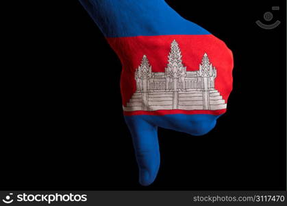 Hand with thumb down gesture in colored cambodia national flag as symbol of negative political, cultural, social management of country