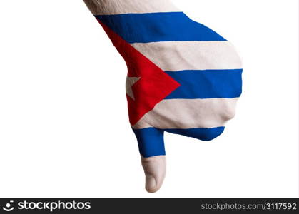 Hand with thumb down gesture in colored cuba national flag as symbol of negative political, cultural, social management of country