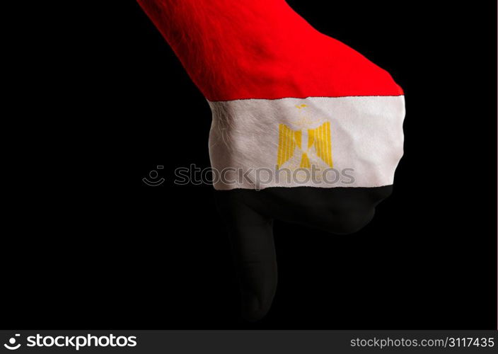 Hand with thumb down gesture in colored egypt national flag as symbol of negative political, cultural, social management of country