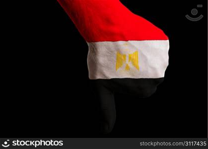 Hand with thumb down gesture in colored egypt national flag as symbol of negative political, cultural, social management of country