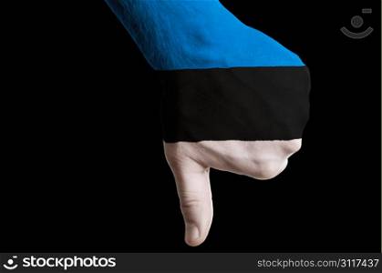 Hand with thumb down gesture in colored estonia national flag as symbol of negative political, cultural, social management of country