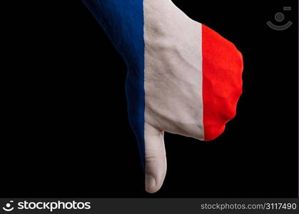 Hand with thumb down gesture in colored france national flag as symbol of negative political, cultural, social management of country