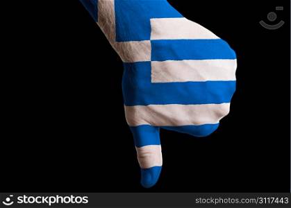 Hand with thumb down gesture in colored greece national flag as symbol of negative political, cultural, social management of country