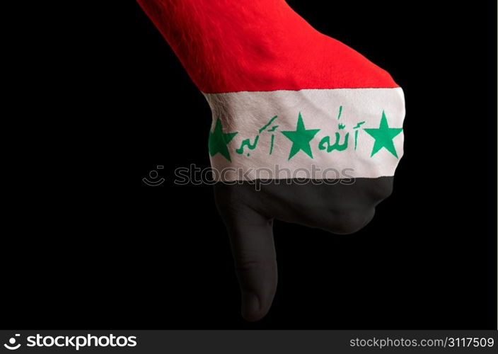 Hand with thumb down gesture in colored iraq national flag as symbol of negative political, cultural, social management of country