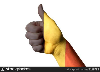 Hand with thumb up gesture colored in belgium national flag as symbol of excellence, achievement, good, - useful for tourism and touristic advertising and also current positive political, cultural, social management of state or country