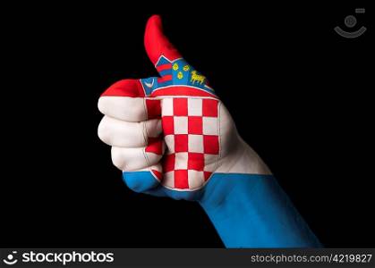 Hand with thumb up gesture colored in croatia national flag as symbol of excellence, achievement, good, - useful for tourism and touristic advertising and also current positive political, cultural, social management of state or country