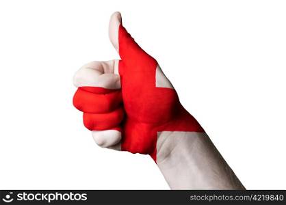 Hand with thumb up gesture colored in england national flag as symbol of excellence, achievement, good, - useful for tourism and touristic advertising and also current positive political, cultural, social management of state or country