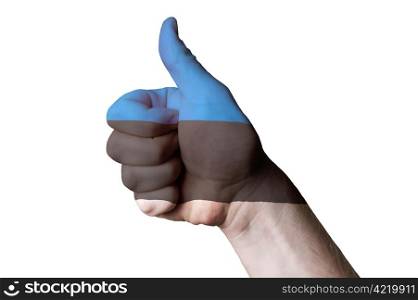 Hand with thumb up gesture colored in estonia national flag as symbol of excellence, achievement, good, - useful for tourism and touristic advertising and also current positive political, cultural, social management of state or country