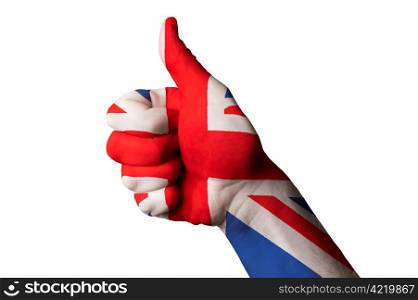 Hand with thumb up gesture colored in great britain national flag as symbol of excellence, achievement, good, - useful for tourism and touristic advertising and also current positive political, cultural, social management of state or country