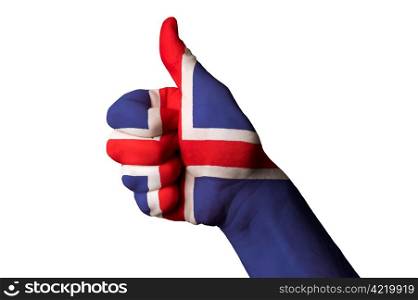 Hand with thumb up gesture colored in iceland national flag as symbol of excellence, achievement, good, - useful for tourism and touristic advertising and also current positive political, cultural, social management of state or country