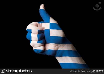 Hand with thumb up gesture colored ingreece national flag as symbol of excellence, achievement, good, - useful for tourism and touristic advertising and also current positive political, cultural, social management of state or country