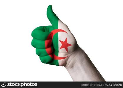 Hand with thumb up gesture in colored algeria national flag as symbol of excellence, achievement, good, - for tourism and touristic advertising, positive political, cultural, social management of country