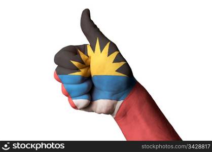 Hand with thumb up gesture in colored antigua barbuda national flag as symbol of excellence, achievement, good, - for tourism and touristic advertising, positive political, cultural, social management of country