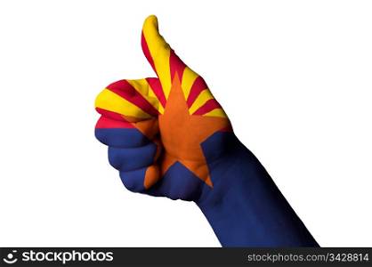 Hand with thumb up gesture in colored arizona usa state flag as symbol of excellence, achievement, good, - for tourism and touristic advertising, positive political, cultural, social management of country