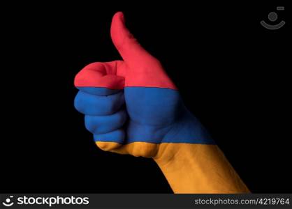 Hand with thumb up gesture in colored armenia national flag as symbol of excellence, achievement, good, - useful for tourism and touristic advertising and also current positive political, cultural, social management of state or country