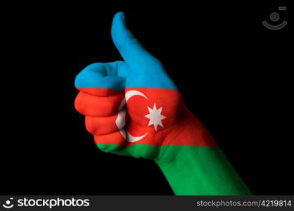 Hand with thumb up gesture in colored azerbaijan national flag as symbol of excellence, achievement, good, - useful for tourism and touristic advertising and also current positive political, cultural, social management of state or country