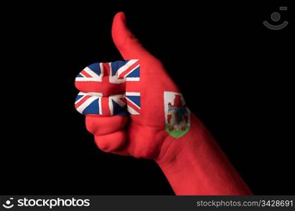 Hand with thumb up gesture in colored bermuda national flag as symbol of excellence, achievement, good, - for tourism and touristic advertising, positive political, cultural, social management of country