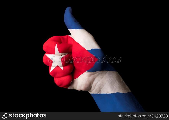 Hand with thumb up gesture in colored cuba national flag as symbol of excellence, achievement, good, - for tourism and touristic advertising, positive political, cultural, social management of country