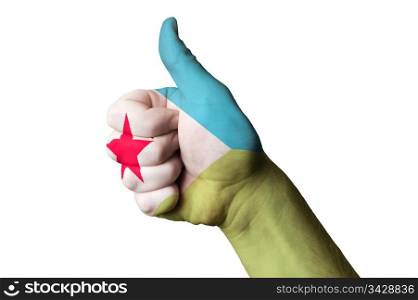 Hand with thumb up gesture in colored djibuti national flag as symbol of excellence, achievement, good, - for tourism and touristic advertising, positive political, cultural, social management of country