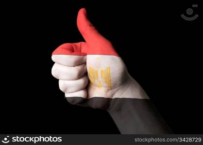 Hand with thumb up gesture in colored egypt national flag as symbol of excellence, achievement, good, - for tourism and touristic advertising, positive political, cultural, social management of country