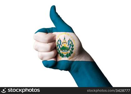 Hand with thumb up gesture in colored el salvador national flag as symbol of excellence, achievement, good, - for tourism and touristic advertising, positive political, cultural, social management of country