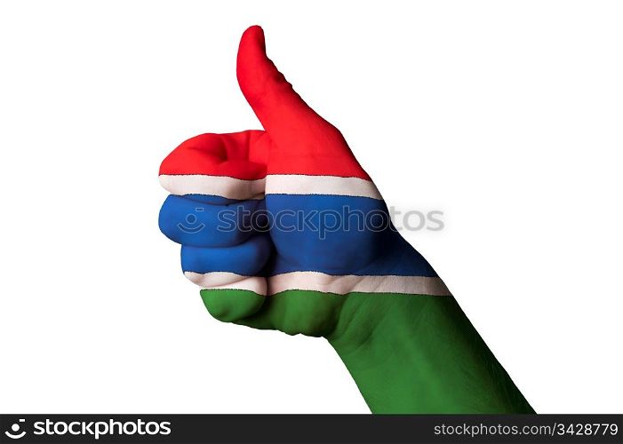 Hand with thumb up gesture in colored gambia national flag as symbol of excellence, achievement, good, - for tourism and touristic advertising, positive political, cultural, social management of country