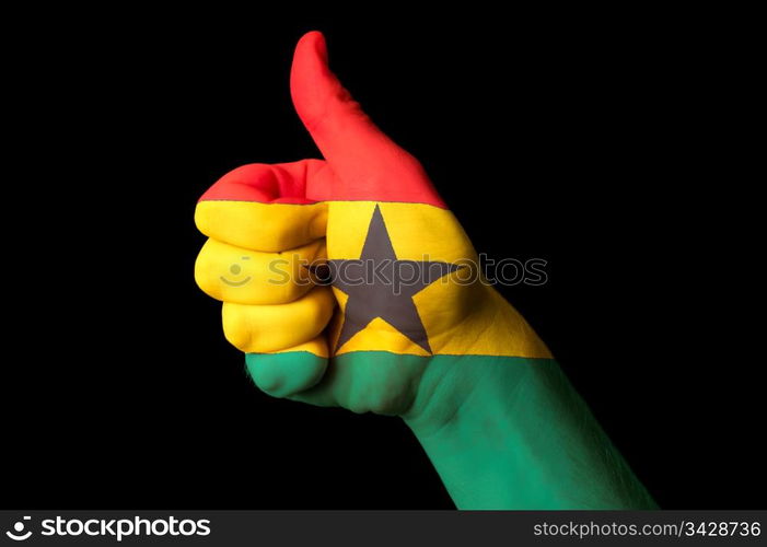 Hand with thumb up gesture in colored ghana national flag as symbol of excellence, achievement, good, - for tourism and touristic advertising, positive political, cultural, social management of country