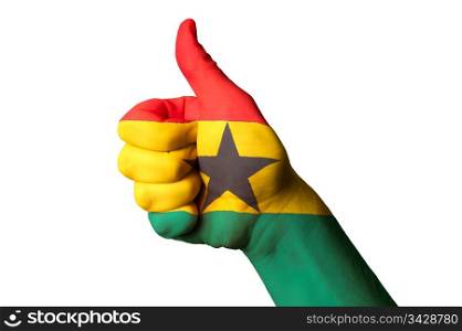 Hand with thumb up gesture in colored ghana national flag as symbol of excellence, achievement, good, - for tourism and touristic advertising, positive political, cultural, social management of country
