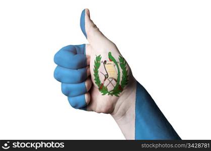 Hand with thumb up gesture in colored guatemala national flag as symbol of excellence, achievement, good, - for tourism and touristic advertising, positive political, cultural, social management of country