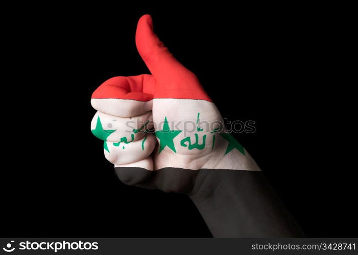 Hand with thumb up gesture in colored iraq national flag as symbol of excellence, achievement, good, - for tourism and touristic advertising, positive political, cultural, social management of country