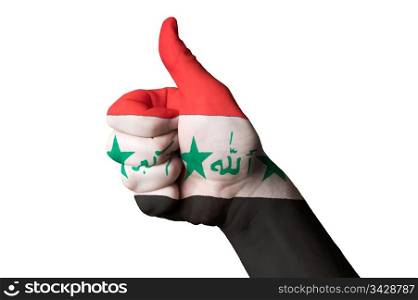 Hand with thumb up gesture in colored iraq national flag as symbol of excellence, achievement, good, - for tourism and touristic advertising, positive political, cultural, social management of country